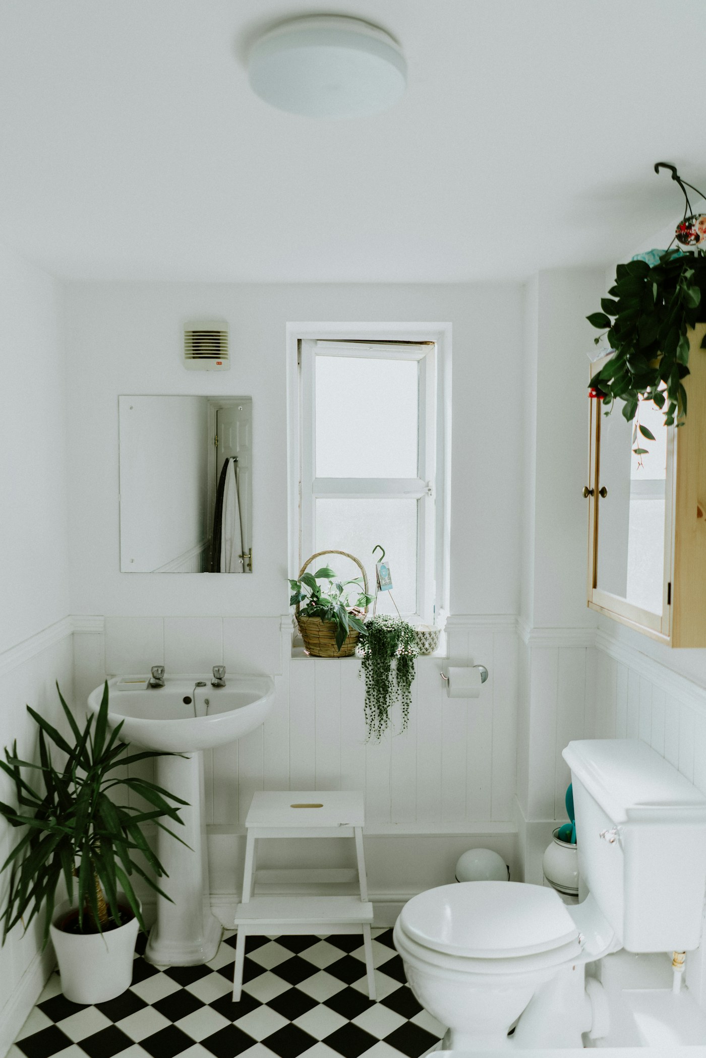A practical bed & bath scene in a lived-in home